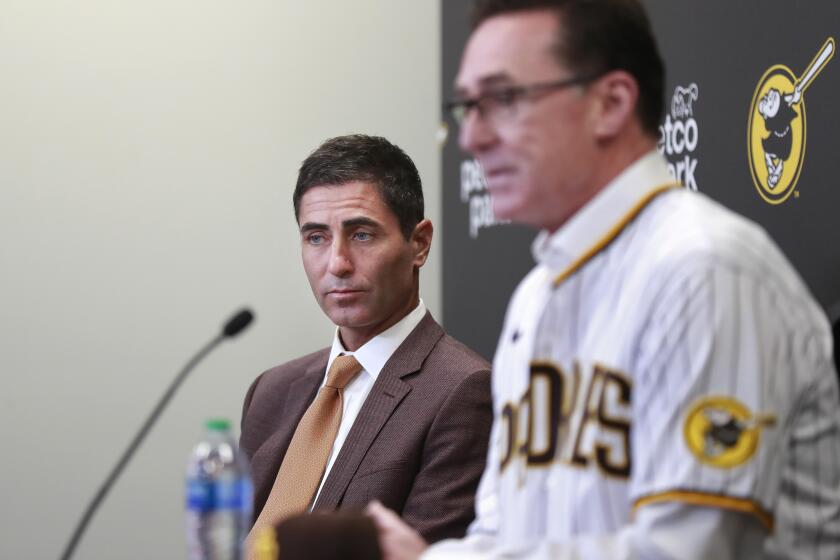 SAN DIEGO, CA - NOVEMBER 1: Padres general manager A. J. Preller, left, looks on as Bob Melvin speaks at a news conference where he was introduced as the Padres manager at Petco Park on Monday, Nov. 1, 2021 in San Diego, CA. (K.C. Alfred / The San Diego Union-Tribune)