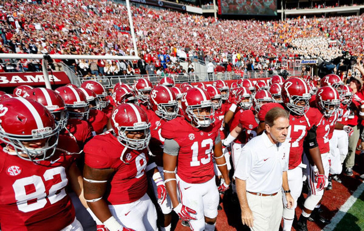 Alabama Coach Nick Saban leads his players onto the field before their Oct. 26 win over Tennessee. This year's Alabama-LSU showdown isn't drawing as much hype as previous editions of the rivalry, but it's still a big game.