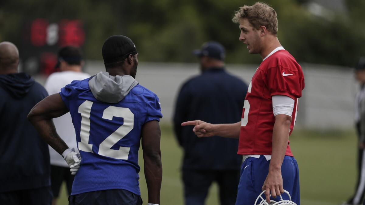 Rams quarterback Jared Goff and receiver Brandin Cooks talk during a break on the first day of organized team activities on May 21.