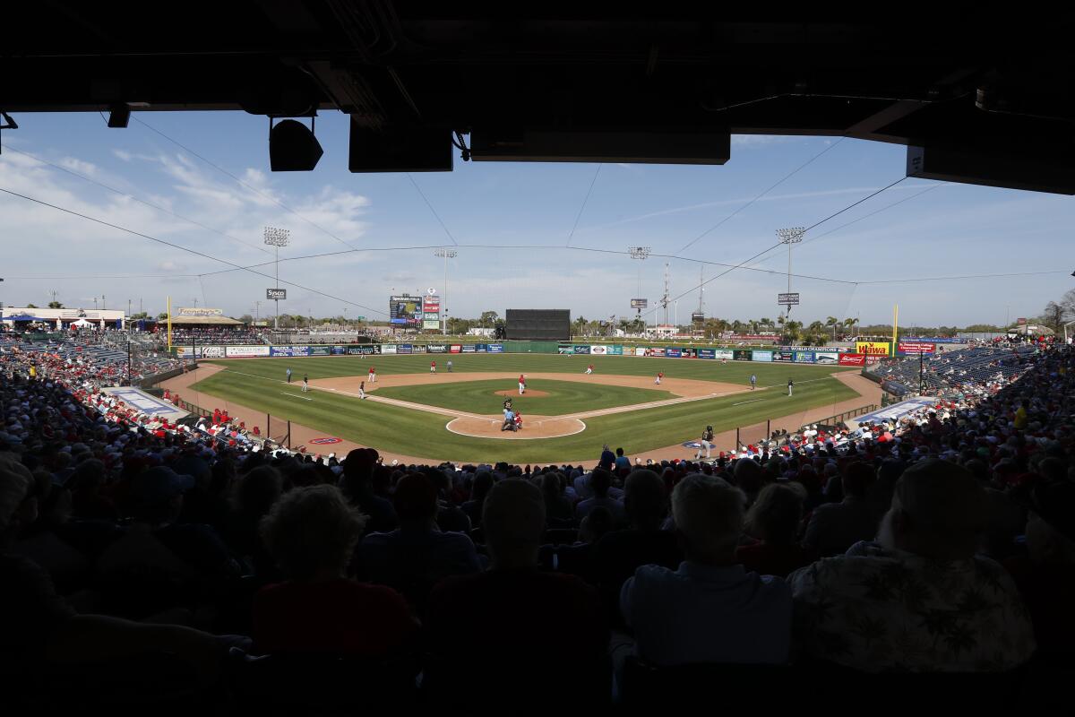 Fans watch a spring training game between the Philadelphia Phillies and Pittsburgh Pirates on March 4 in Clearwater, Fla. 