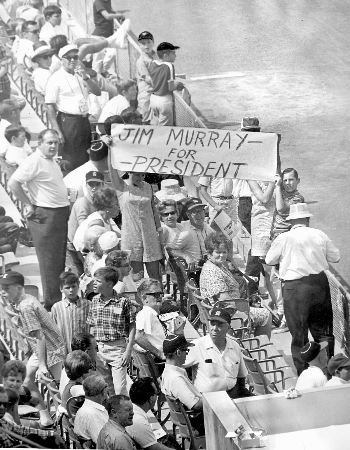 Fans hold up a sign, "Jim Murray for President" during the 1967 MLB All-Star Game at Angel Stadium.