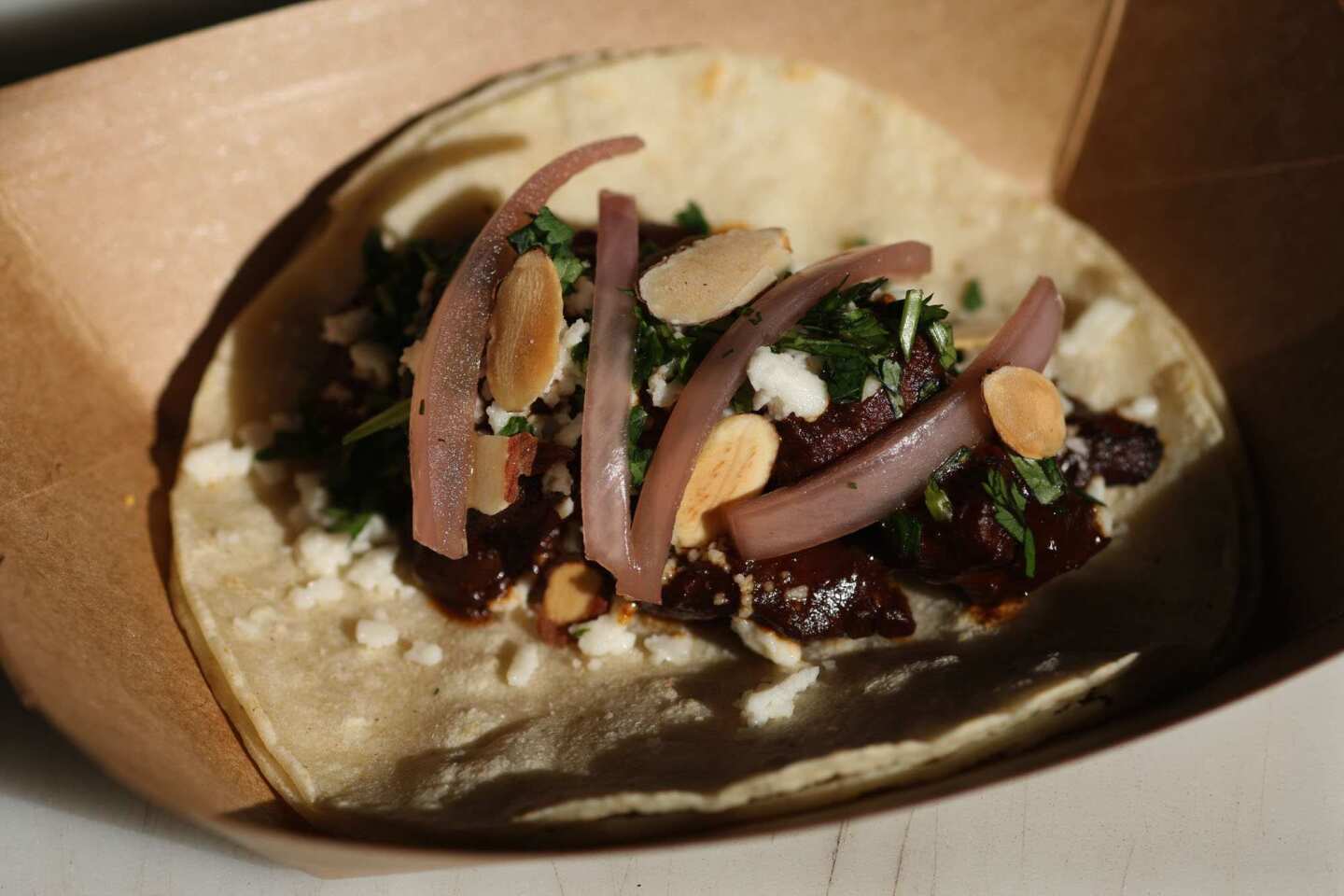 The chicken mole taco is endowed with complex flavors.
