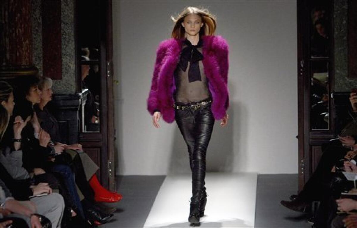 Top model Carmen Kass presents a creation by French designer Christophe  Decarnin for Balmain Fall-Winter