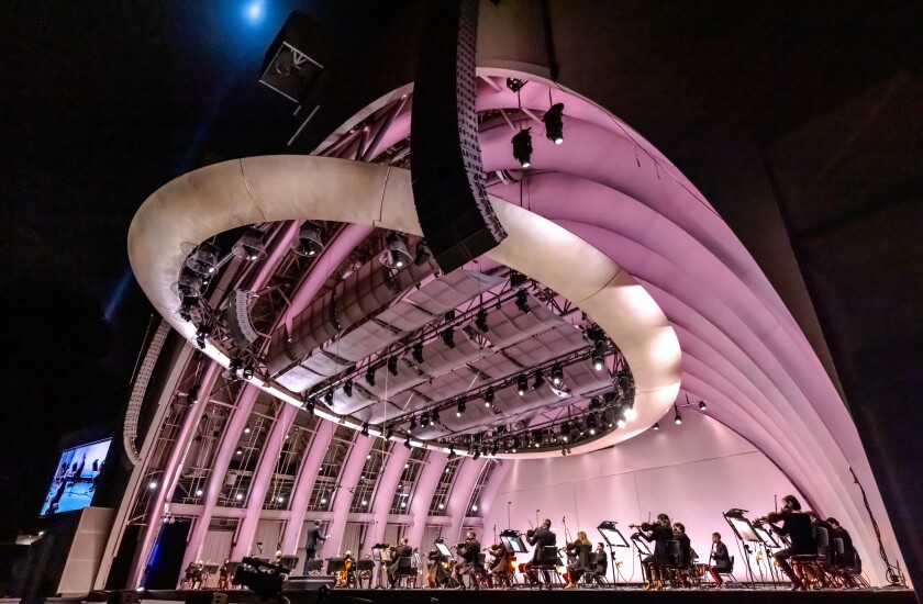 The Hollywood Bowl shell glows a soft purple during the L.A. Phil's reopening concert Saturday night. 