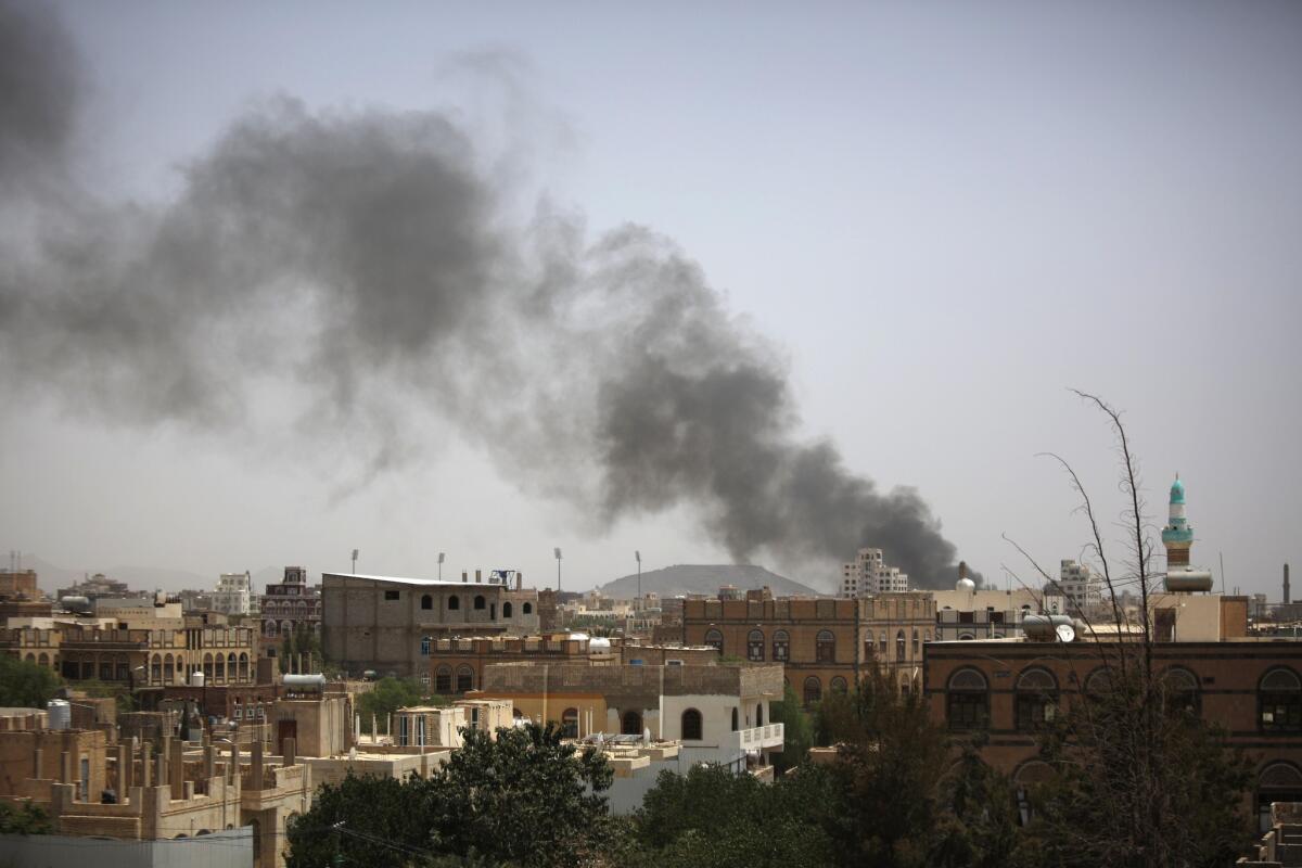 Smoke rises after an airstrike in Yemen's capital, Sana, on July 10. Loud explosions were heard in the city before a U.N.-brokered cease-fire took effect at midnight.