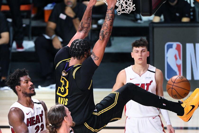 Lakers forward Anthony Davis throws down a dunk in the fourth quarter of Game 2 against the Heat on Friday night.