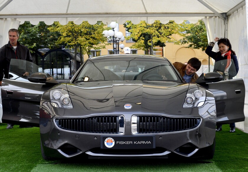 The Fisker Karma, a plug-in hybrid luxury sports sedan produced by Fisker Automotive, is displayed at the Stockholm Car Festival in Sweden on Sept. 21, 2012.