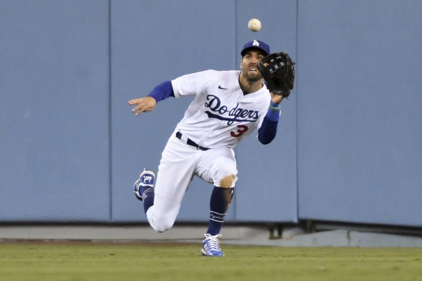 Los Angeles, CA - October 11: Los Angeles Dodgers center fielder Chris Taylor catches a fly ball.