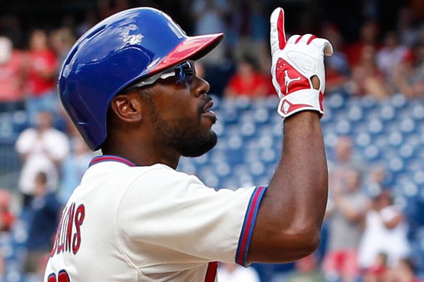 Philadelphia Phillies shortstop Jimmy Rollins celebrates after hitting a two-run home run against the St. Louis Cardinals on Aug. 24. Rollins wants to be a leader on and off the field for the Dodgers.