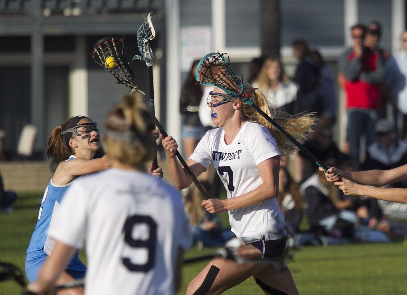 Newport Harbor High captain Sarah Farley rushes the Corona del Mar net for a goal during the Battle of the Bay.