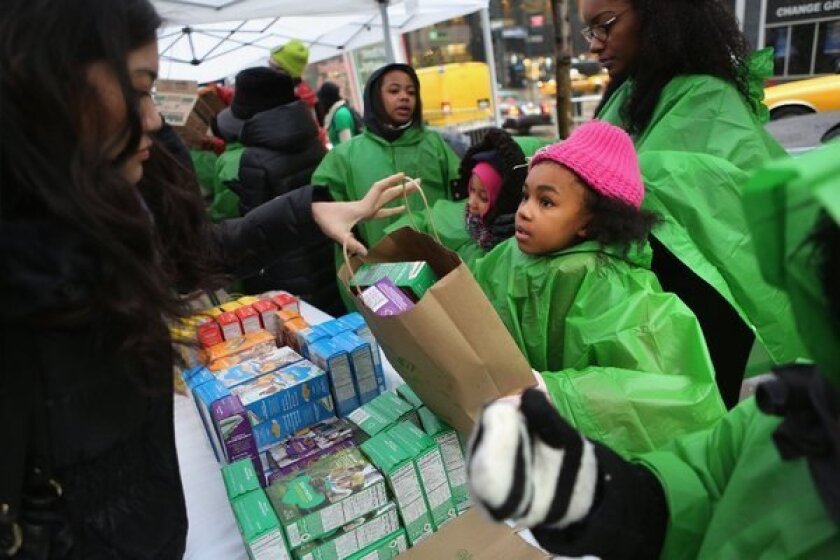 Girl Scouts sell cookies in New York.