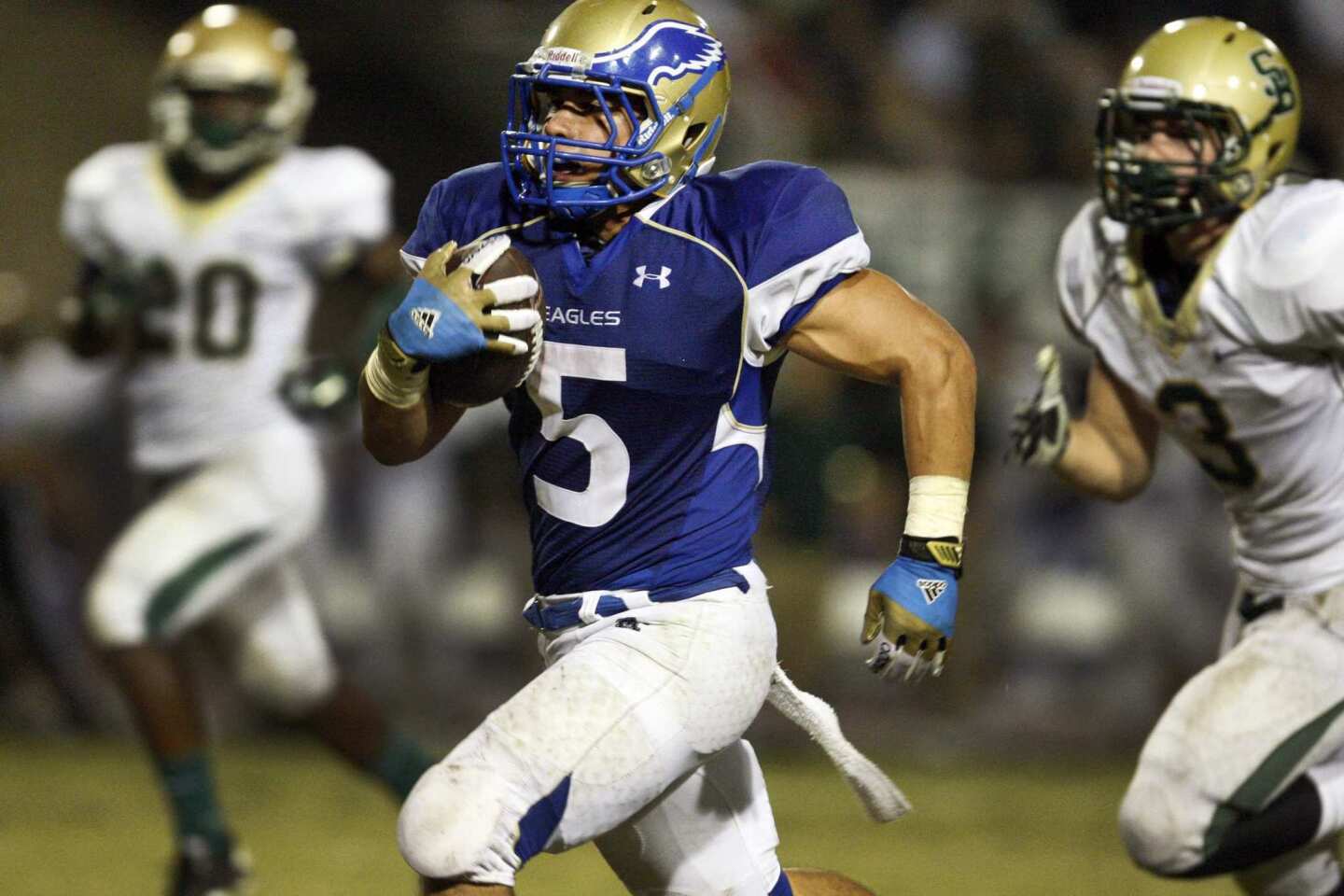 Santa Margarita running back Ryan Wolpin, who had 204 yards rushing and three touchdowns, heads toward the end zone against St. Bonaventure for the game-clinching touchdown in the fourth quarter Friday night.