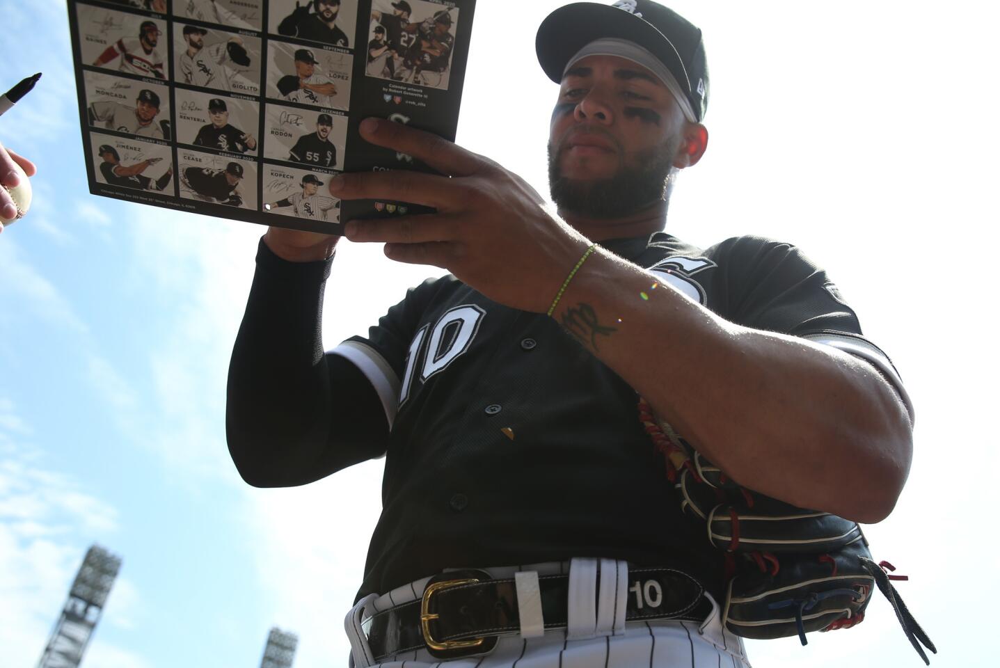 White Sox third baseman Yoan Moncada signs autographs before a game against the Royals on April 17, 2019, at Guaranteed Rate Field.