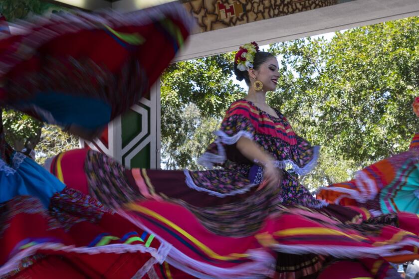 San Diego, California - April 22: Members of Ballet Folklorico Xochipilli perform during Chicano Park Day on Saturday, April 22, 2023 in San Diego, California. This was the first time for an in-person event since 2019. Community members and activists occupied the space under the Interstate 5 and the Coronado Bridge to create the park 53 years ago. (Ana Ramirez / The San Diego Union-Tribune)