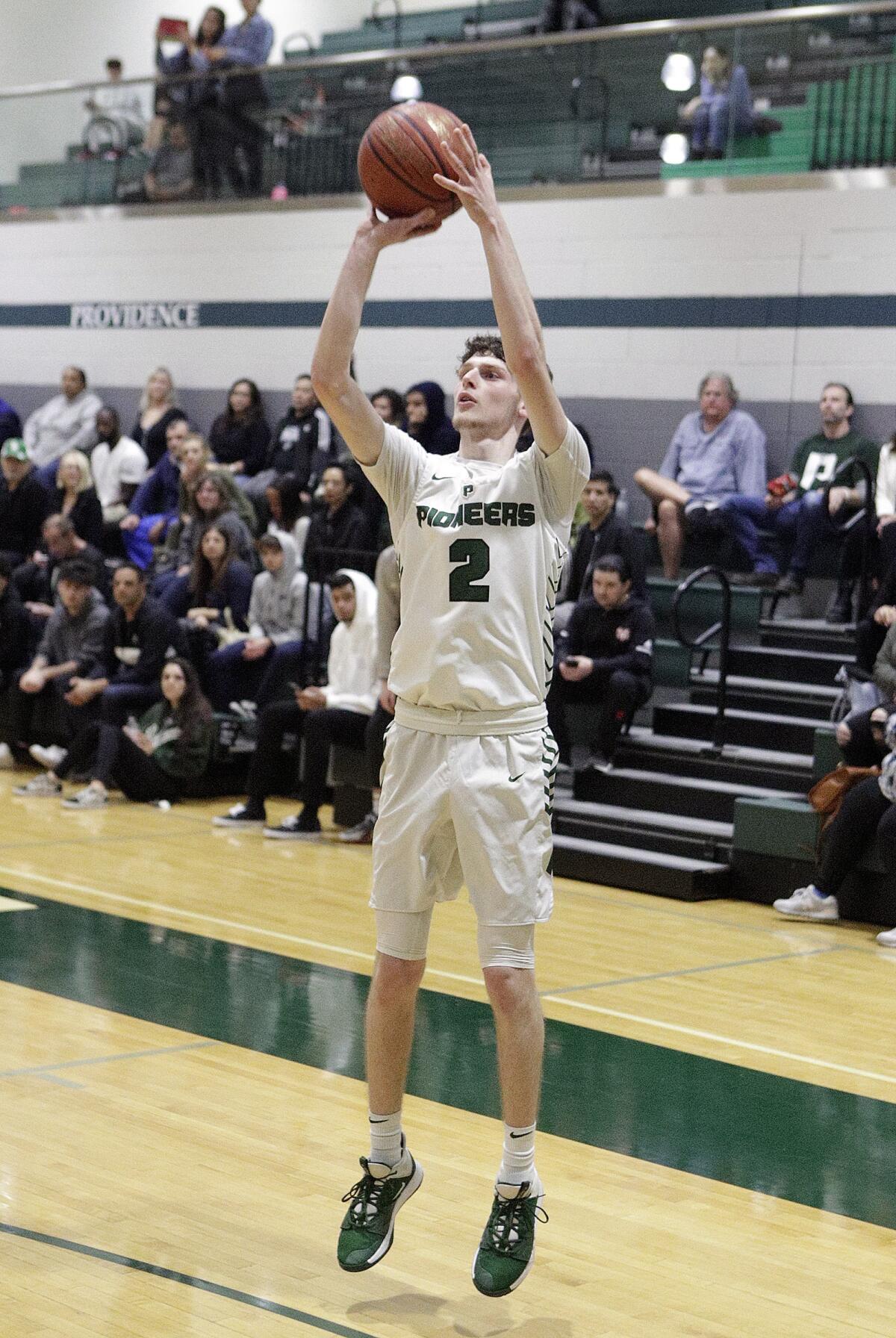 Providence's Andrew Dabbaghian pulls up for a three-point shot against La Serna in the CIF Southern Section Division III-AA quarterfinal boys' basketball playoff at Providence High School on Tuesday, February 18, 2020.