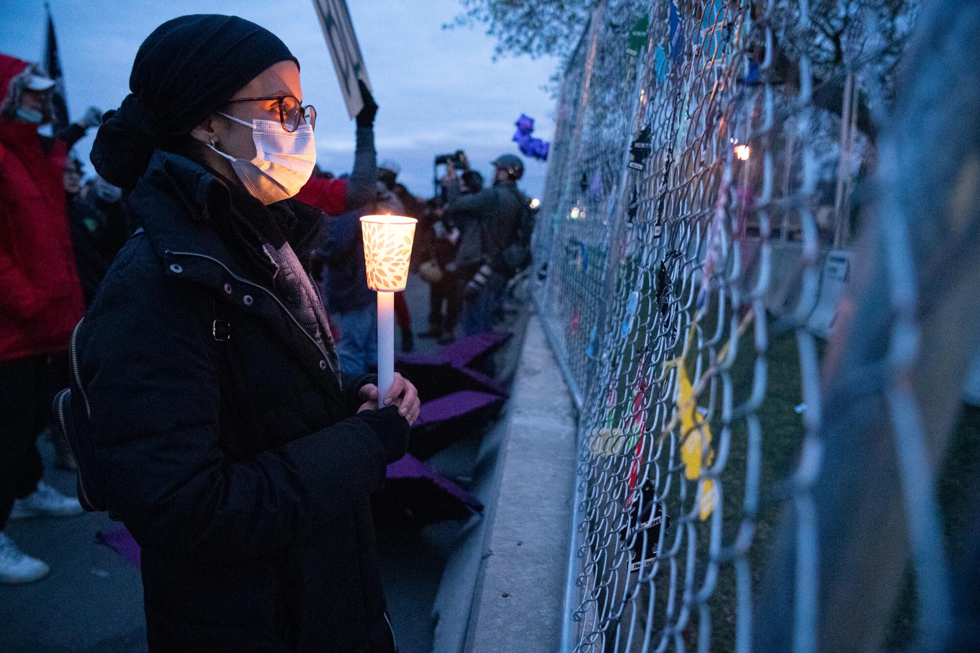 A protester holds a candle