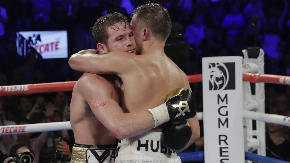 Canelo Alvarez and Gennady Golovkin embrace after their middleweight title fight.