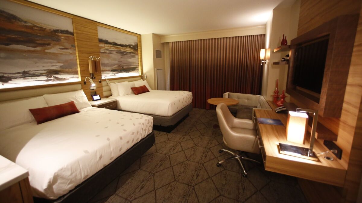 A mock hotel room shows what Sycuan Casino's standard accommodations with two double beds will look like. Sycuan's first hotel will open in March. The understated decor is meant to capture a timeless elegance, said tribal chairman Cody Martinez.
