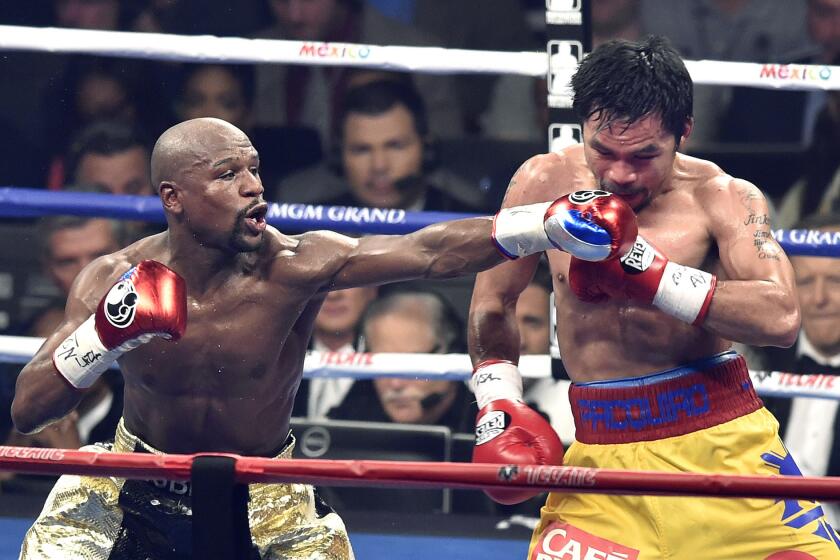 Floyd Mayweather Jr., left, and Manny Pacquiao battle during the World Welterweight Championship at the MGM Grand in Las Vegas last May.