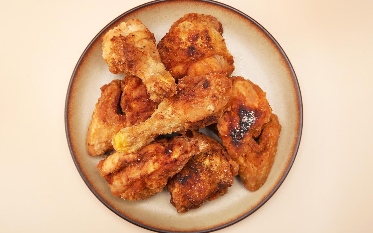 Simple fried chicken needs only salt, pepper and a sprinkling of garlic powder to highlight the umami sweetness of the bird.