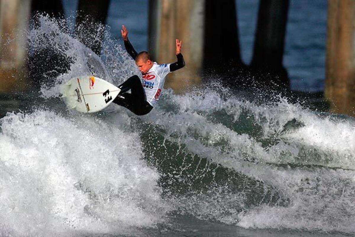 Kolohe Andino goes for air during a qualifying round of the Pro Junior Men's Grade 2 contest at the U.S. Open of Surfing in Huntington Beach on July 18, 2009.