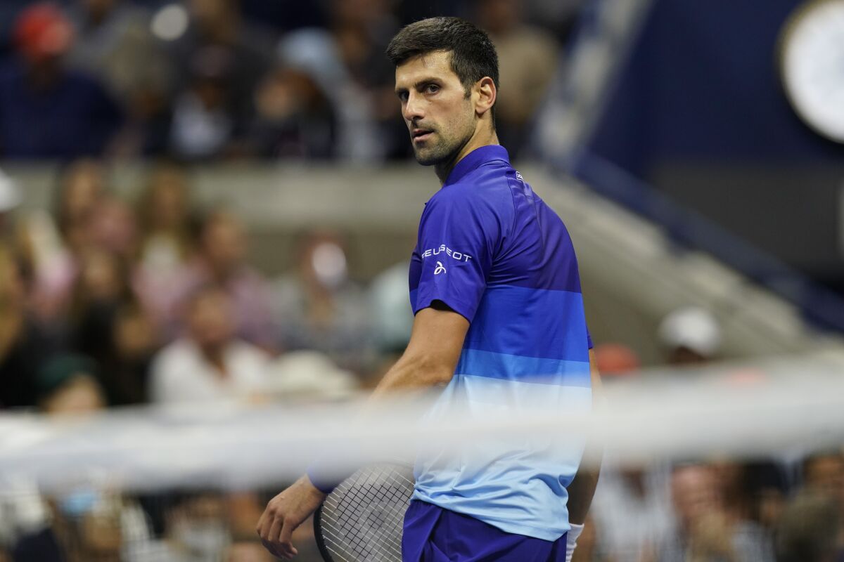 Novak Djokovic, of Serbia, looks over his shoulder during a match against Tallon Griekspoor, of the Netherlands, during the second round of the US Open tennis championships, Thursday, Sept. 2, 2021, in New York. (AP Photo/Frank Franklin II)