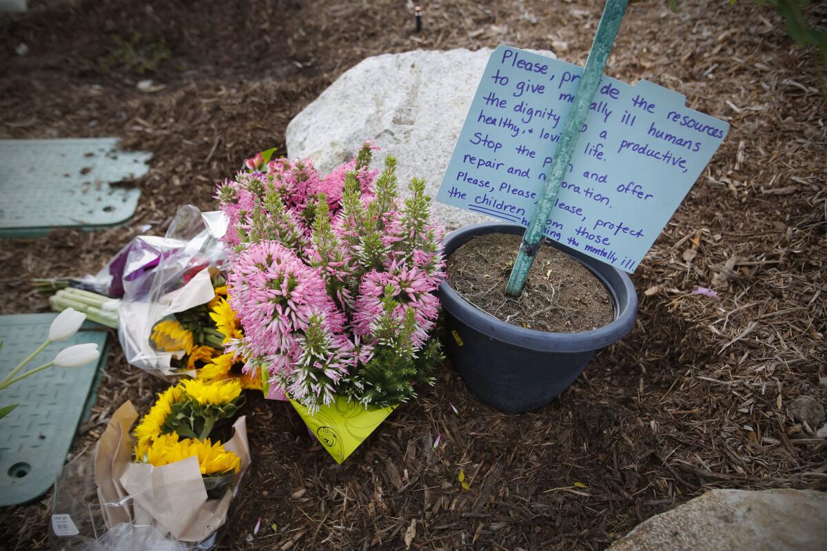 A memorial of flowers is starting to grow in front of Torrey Pines High School (Howard Lipin / San Diego Union-Tribune)