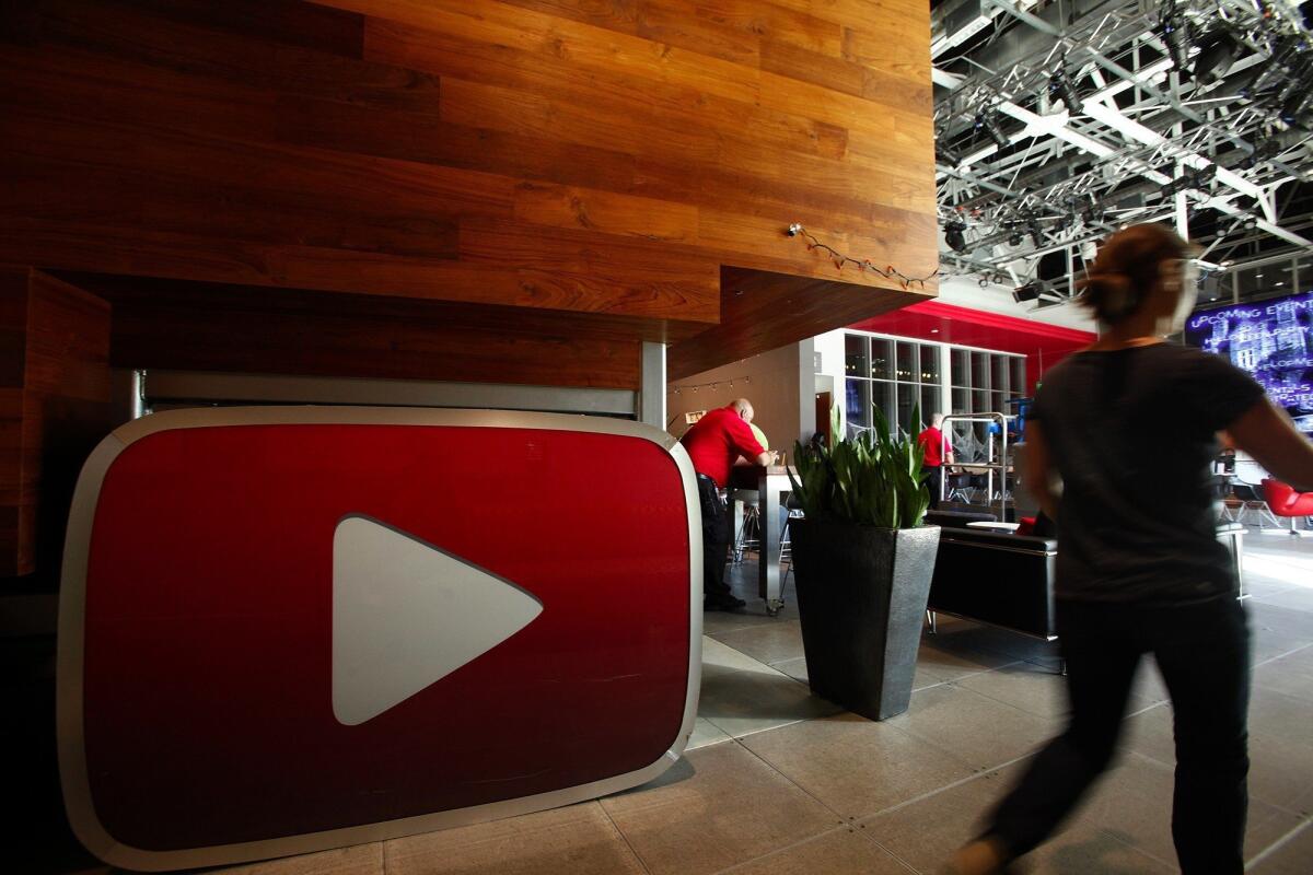 A large version of the iconic YouTube play button in the lobby of YouTube Space LA.