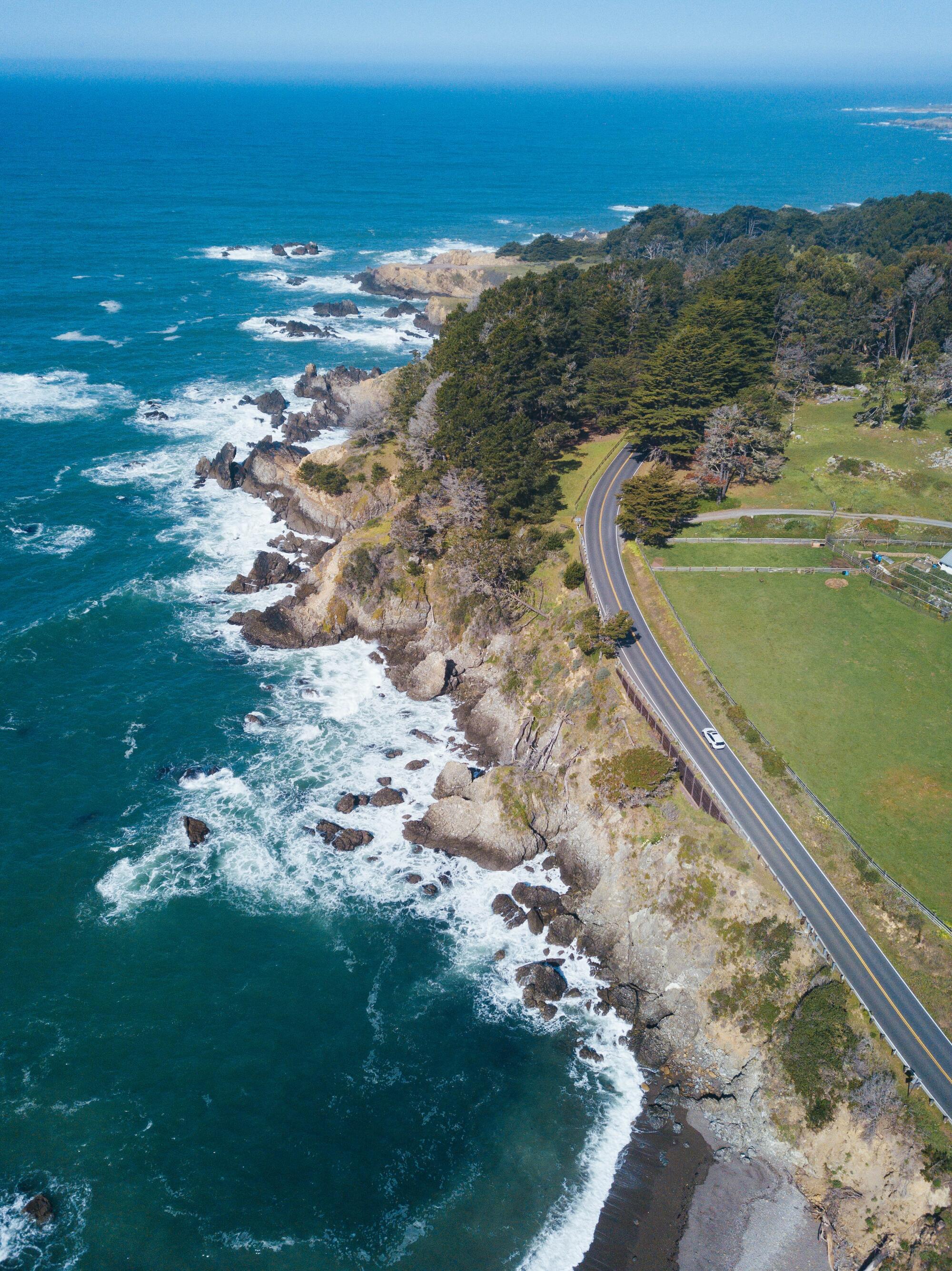 Aerial view of the Coast Highway as it follows the curve of the coastline near Stockhoff Creek in Jenner.