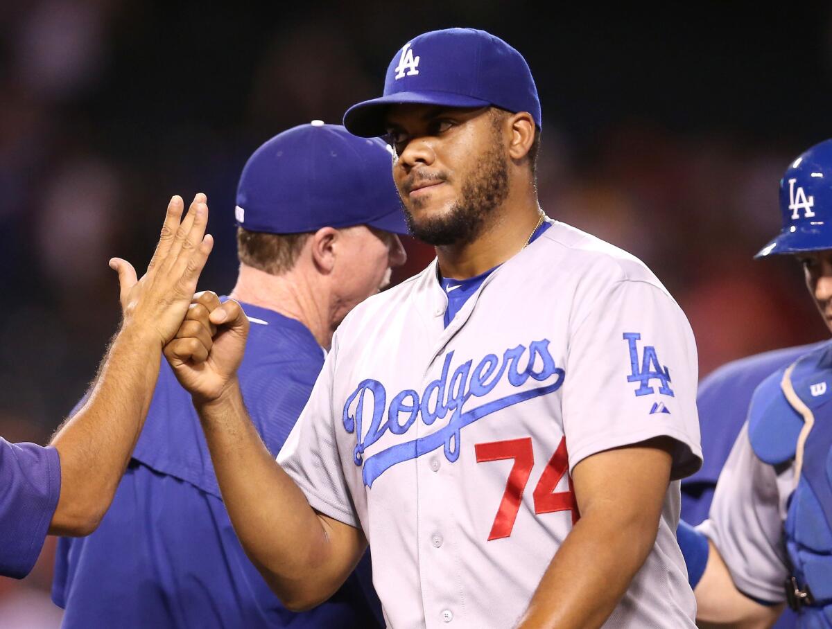 Dodgers closer Kenley Jansen celebrates with teammates after finishing off a game on the mound against teh Angels earlier this month.