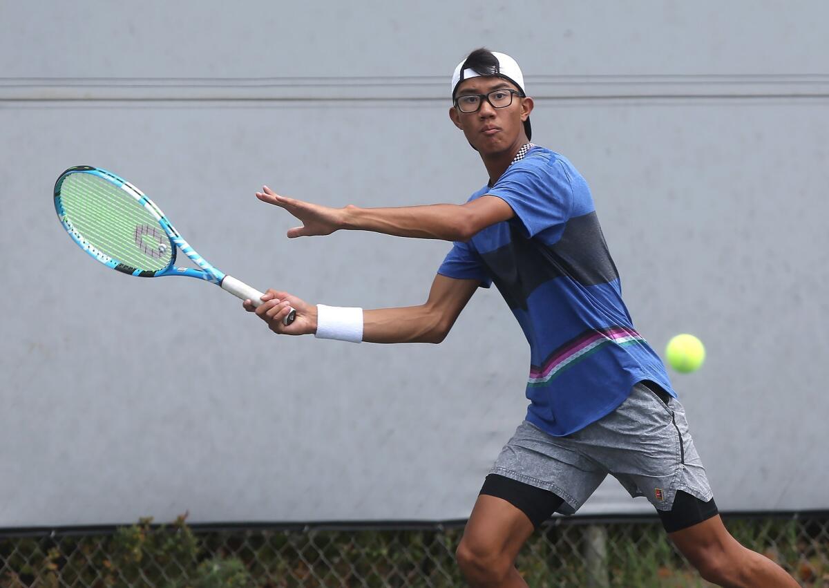 Andy Hernandez of Fullerton runs down a forehand in the boys' 16-and-under quarterfinal against Lawee Sherif of Huntington Beach in the USTA Southern California Junior Sectional Championships at Los Caballeros Sports Village on Friday.