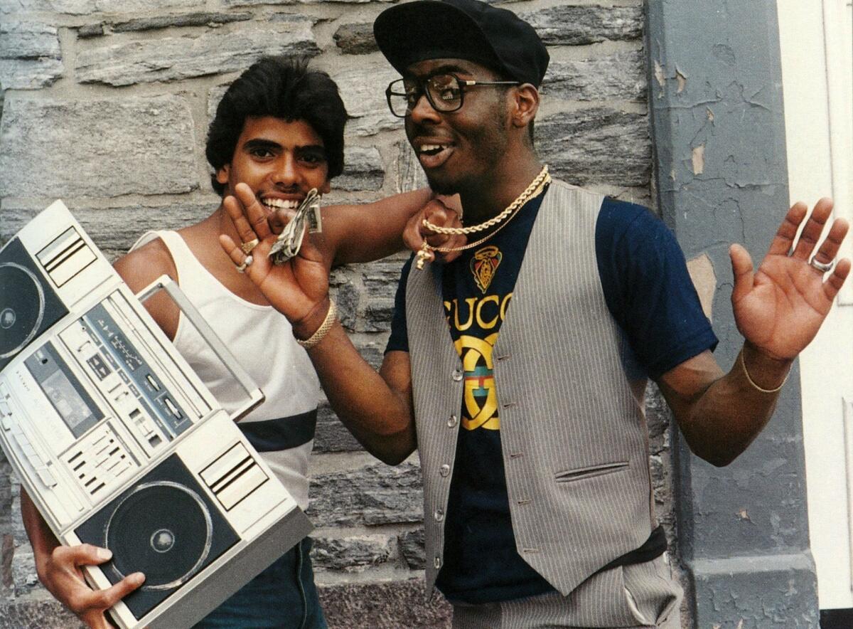 A scene from "Fresh Dressed," a documentary that explores the roots of hip-hop fashion from Southern plantation culture and the rise of Little Richard to the gang warfare of burned-out 1970s South Bronx in New York and knockoff king Dapper Dan, right, in Harlem.