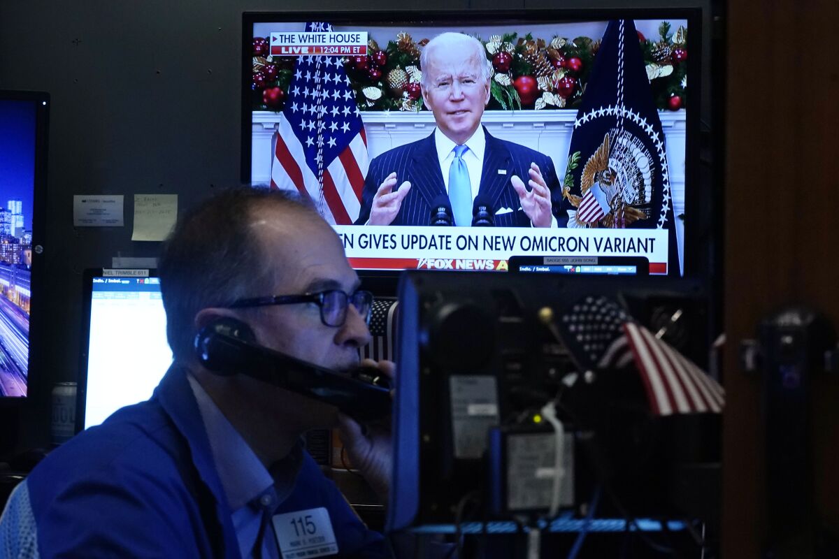President Biden appears on a screen as traders work on the floor of the New York Stock Exchange on Nov. 29. 