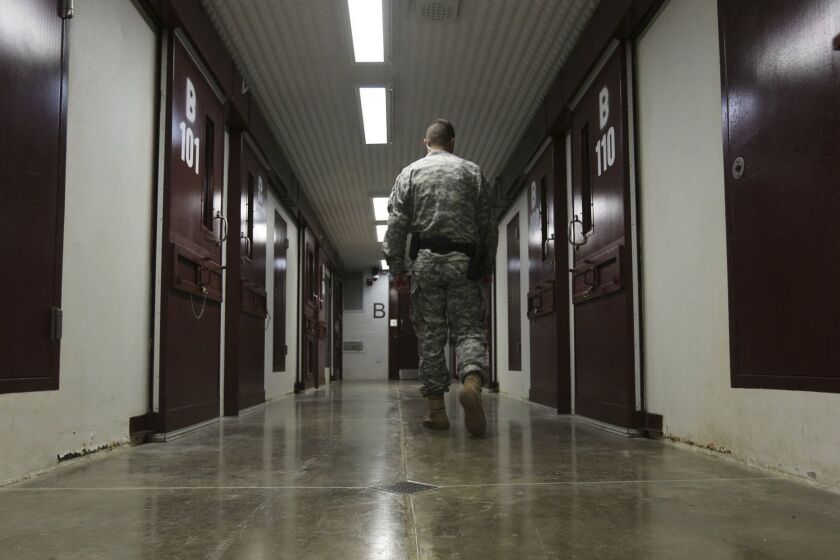 An Army guard walks the hallway in Camp 5 in August, 2012. Guantanamo prison guards practiced for something that hasn't happened at Guantanamo in a decade. They rehearsed receiving a new war-on-terror detainee. (Walter Michot/Miami Herald/TNS) ** OUTS - ELSENT, FPG, TCN - OUTS **