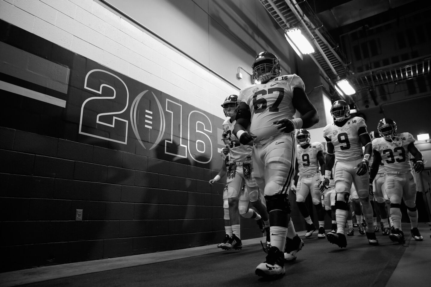 Alabama offensive lineman Josh Casher (67) leads the team onto the field after halftime.
