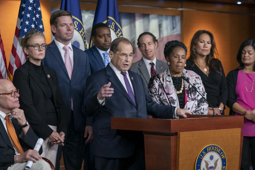 House Judiciary Committee Chairman Jerrold Nadler, D-N.Y., center, and Democratic members of that panel, speak to reporters about this week's testimony from former special counsel Robert Mueller and their plan to continue to investigate President Donald Trump and Russia's interference in the election, at the Capitol in Washington, Friday, July 26, 2019. Nadler says they are seeking enforcement of a subpoena against former White House counsel Donald McGahn, a key Mueller witness. (AP Photo/J. Scott Applewhite)