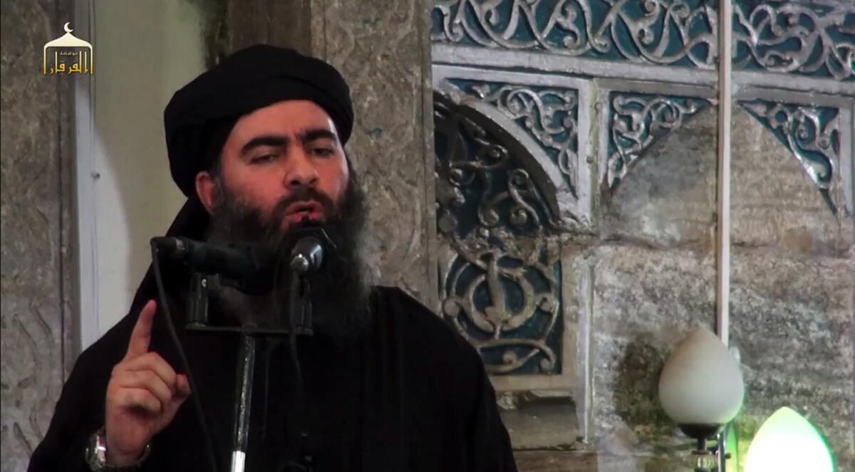 Abu Bakr Baghdadi is purportedly seen addressing worshipers at a mosque in the northern Iraqi city of Mosul in an image grab taken in 2014 from a propaganda video by Islamic State's Furqan media arm.