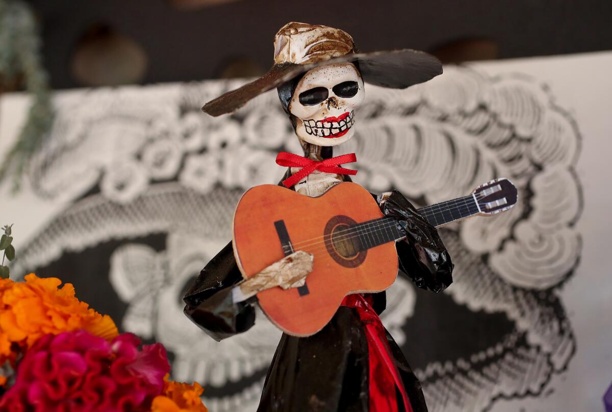 A figurine of a skeleton mariachi.