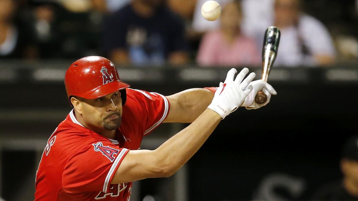 Angels first baseman Albert Pujols grounds into a double play with the bases loaded in the eighth inning Tuesday night in Chicago.