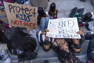Dozens of high school students at Miguel Contreras Learning Complex walked out to show their support for students and families in Uvalde, Texas, by rallying outside Los Angeles City Hall on Tuesday, May 31, 2022. (AP Photo/Damian Dovarganes)