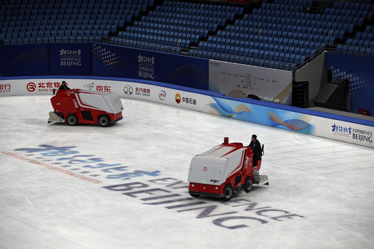 Zambonis resurface the ice skating rink at the Capital Indoor Stadium in Beijing