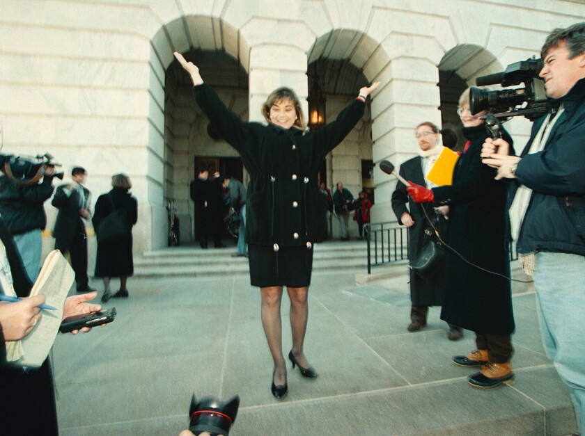 Rep. Loretta Sanchez gestures on the steps of a congressional office building in Washington during orientation week for new members of Congress.