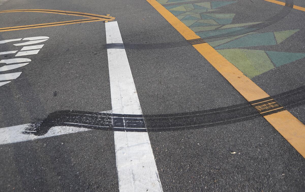 Tire marks are seen at a crosswalk. 