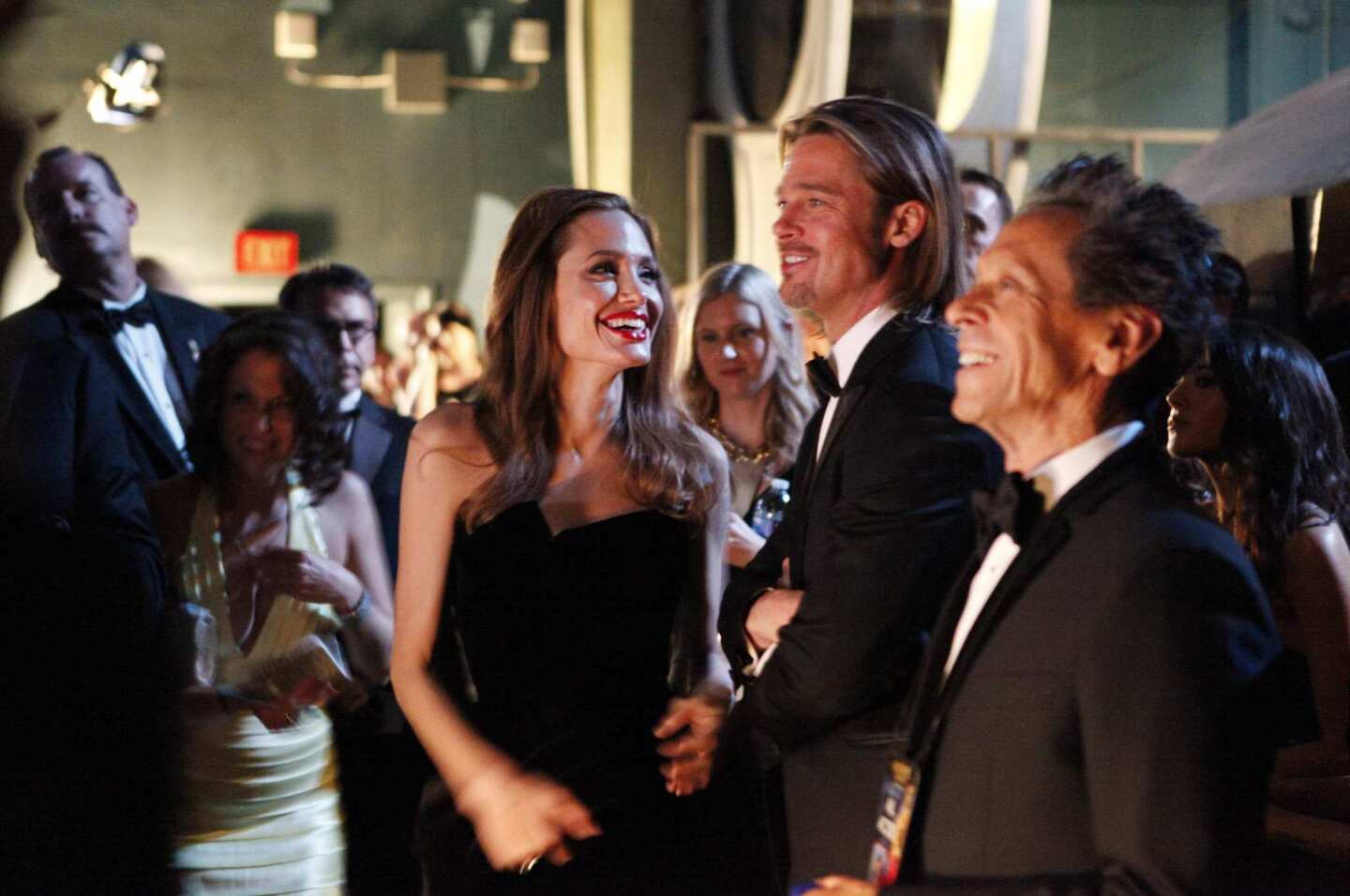 Angeline Jolie and Brad Pitt wait backstage at the 2012 Oscars.