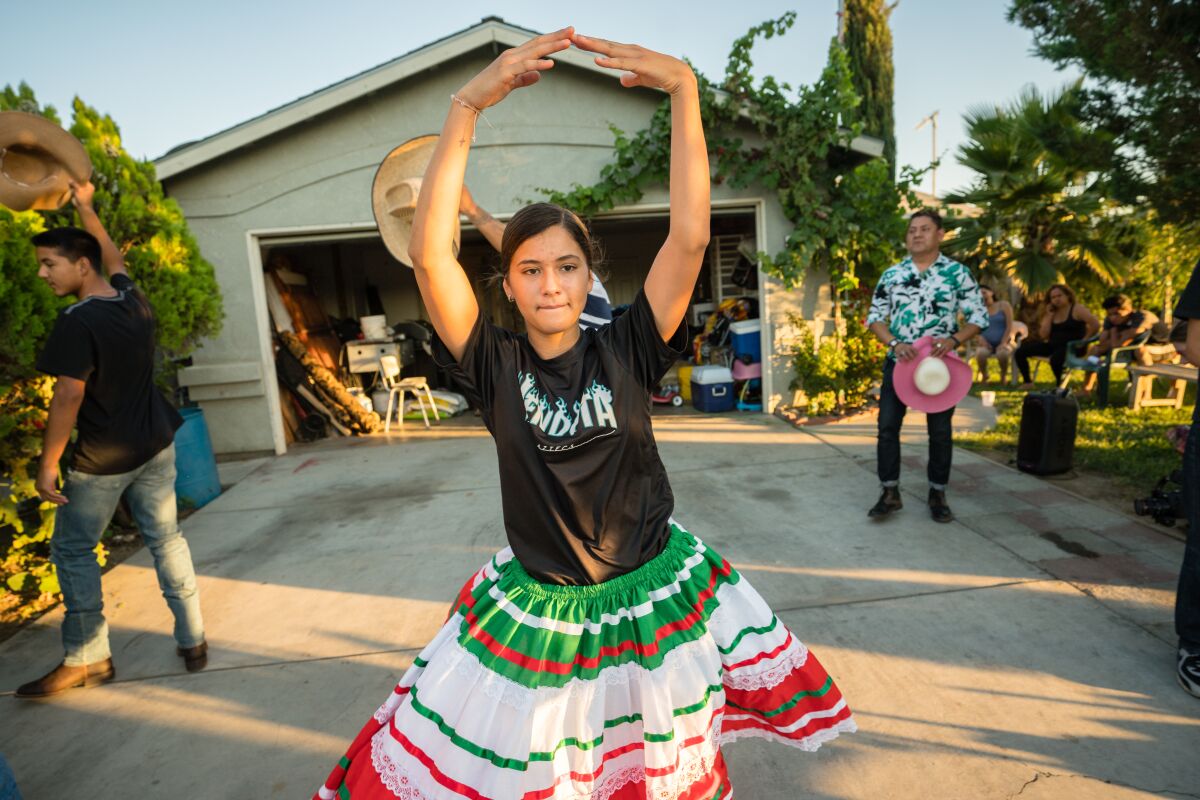 Magali Ceja practices a dance for her quinceañara.