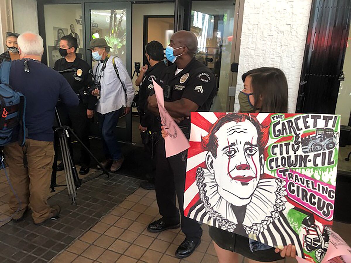 Protesters disrupted the celebration of a new office space for a city dept that will investigate human rights complaints.