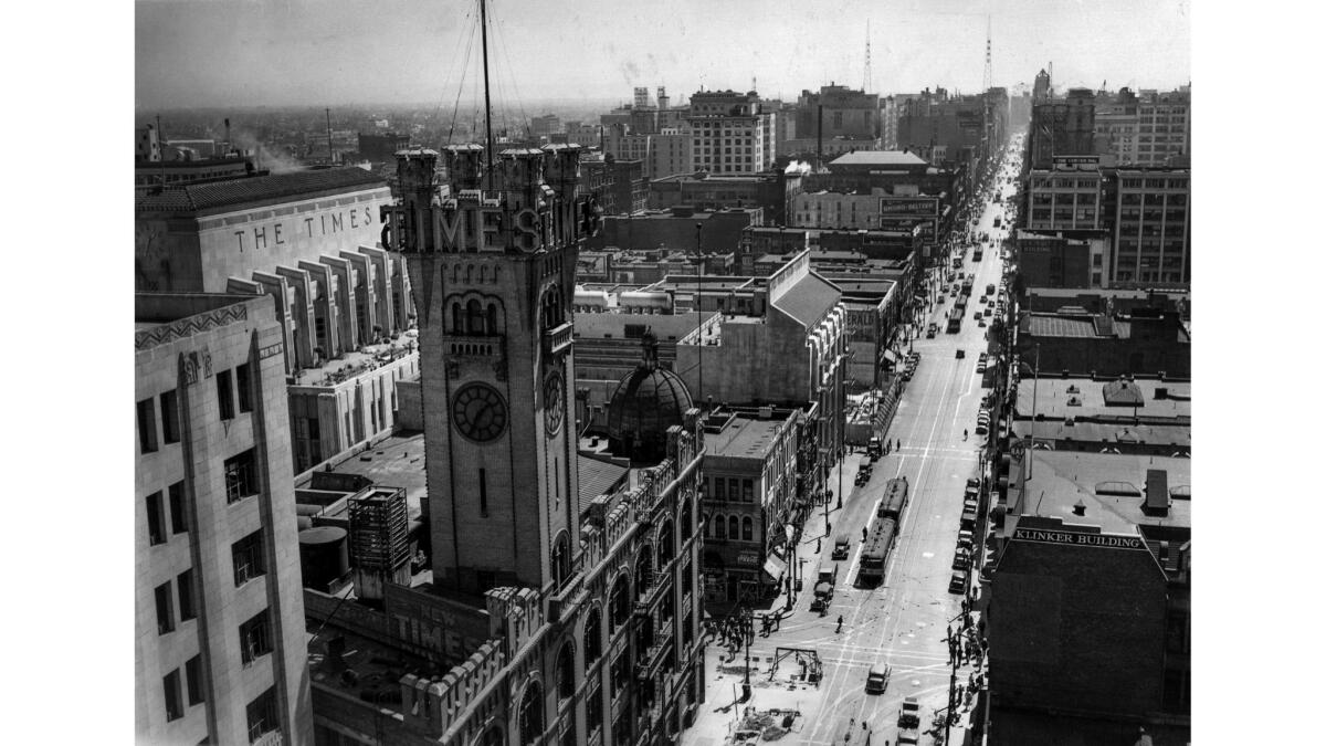 May 4, 1936: In a rooftop view looking down Broadway, the third Los Angeles Times building dominates the intersection at First Street. The current Times building is in left, background.