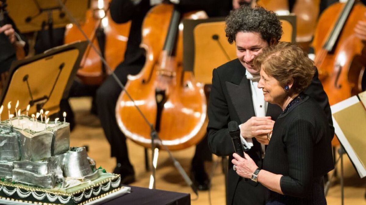 L.A. Phil President Deborah Borda surprises Gustavo Dudamel with a cake for his 36th birthday following the orchestra's performance at the Walt Disney Concert Hall on Jan. 26.