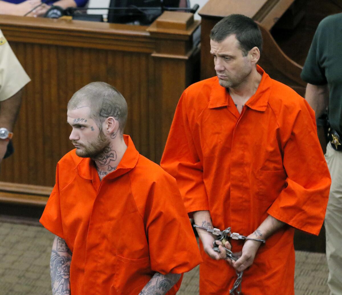 FILE - In this June 21, 2017, file photo, Ricky Dubose, left, and Donnie Russell Rowe enter the Putnam County courthouse in Eatonton, Ga. Dubose has been found guilty of murder on Monday, June 13, 2022, in the killings of two guards during an escape from a prison bus five years ago. Dubose and Donnie Rowe escaped together from the bus in Putnam County, southeast of Atlanta, and were arrested in Tennessee days later. Rowe was convicted last year of murder in the guards’ death. (Bob Andres/Atlanta Journal-Constitution via AP, Pool, File)