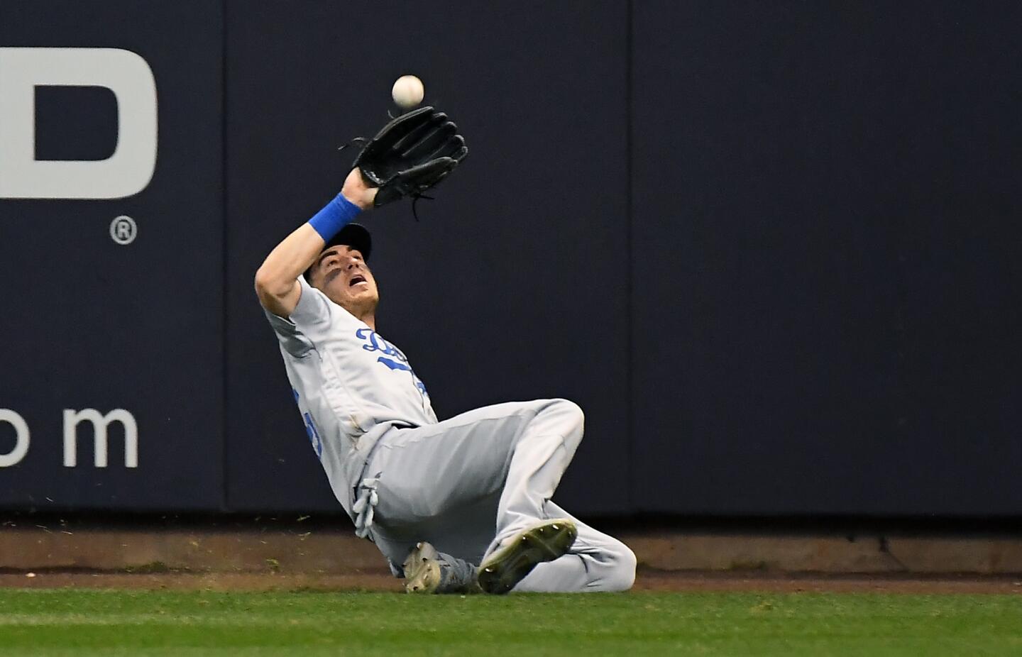 Dodgers Cody Bellinger makes a sliding catch off the bat of Brewers Ryan Braun in the 8th inning.